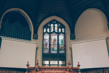 Stained Glass Windows above an altar 