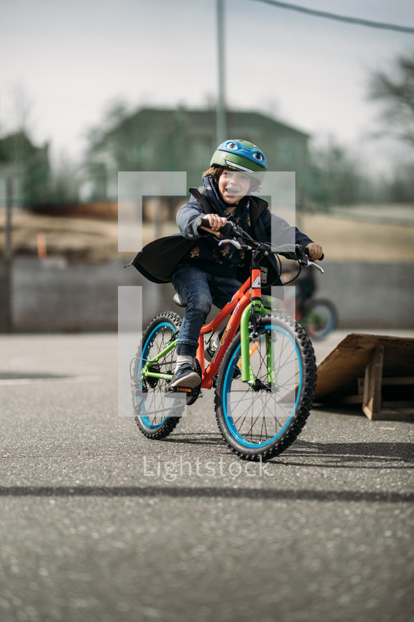 child riding a bike at a park 