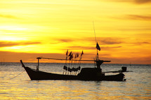 A fishing boat at sunset