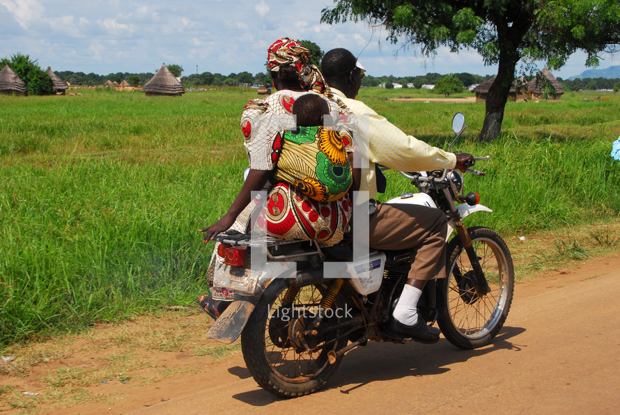 family on a motor bike in Africa