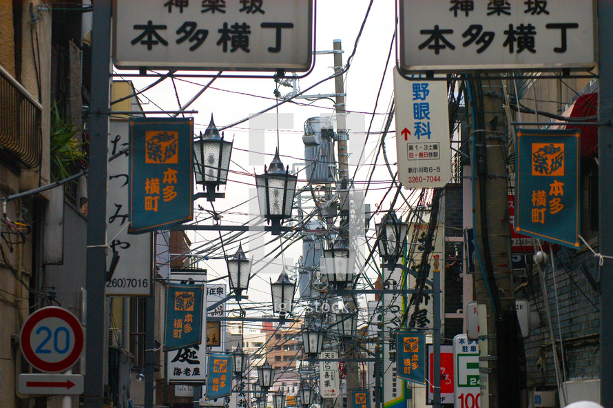 A view of a cluttered Japanese street 
