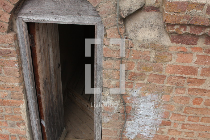open door on a brick cellar