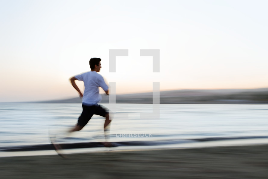 man running on the beach 