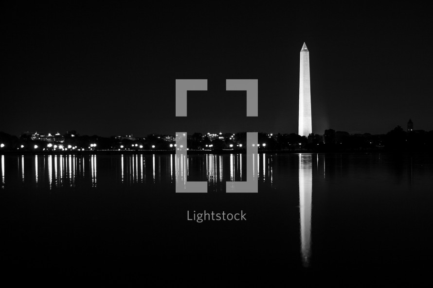 Washington Monument at night reelected in water