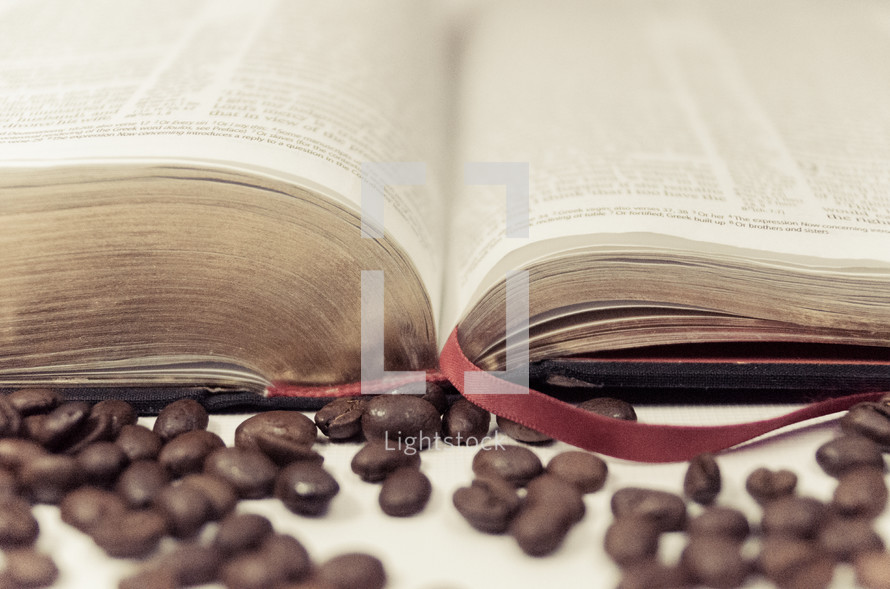 coffee beans and open Bible 