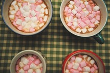 marshmallows in mugs of hot chocolate 