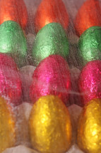 bright foil wrapped chocolate eggs lined up