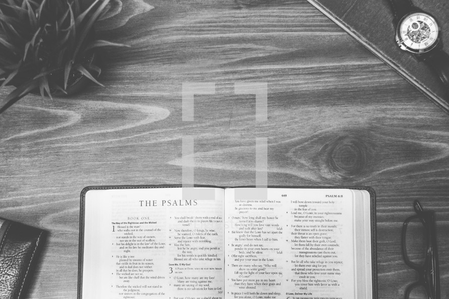 The Psalms, open Bible, Bible, pages, reading glasses, wood table 