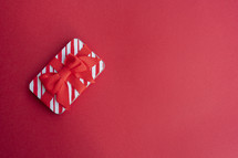 Small gift on red background