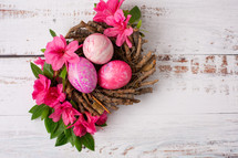 pink flowers and pink eags in a nest 