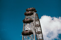 London Eye tourist attraction, capital city, England travel and tourism ferris wheel.