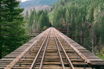 train tracks on a bridge 