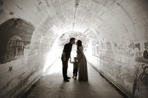 a young family standing in a tunnel 