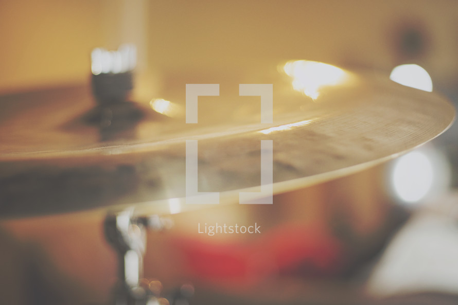 a blurred focus of cymbal and lights