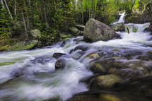 rapids, Alberta Falls rushing water as the snow melts in Rocky Mountain National Park outside of Estes Park Colorado