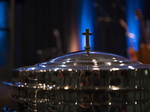 A communion tray and cross at a church service