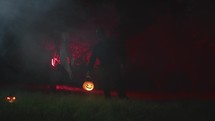 Scary monster walking with halloween pumpkin