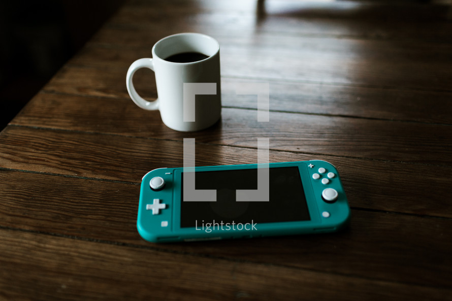 coffee and handheld video game device 