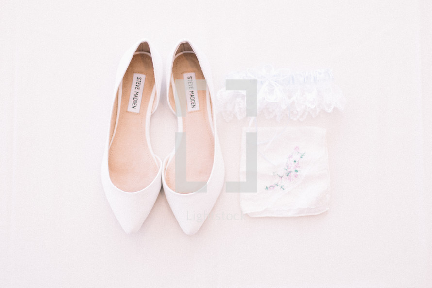 wedding shoes, lace garter, and handkerchief 