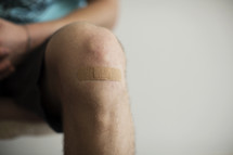 a band-aid on a knee 