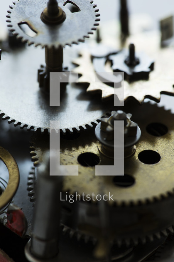 macro photo of gears in a clock. 