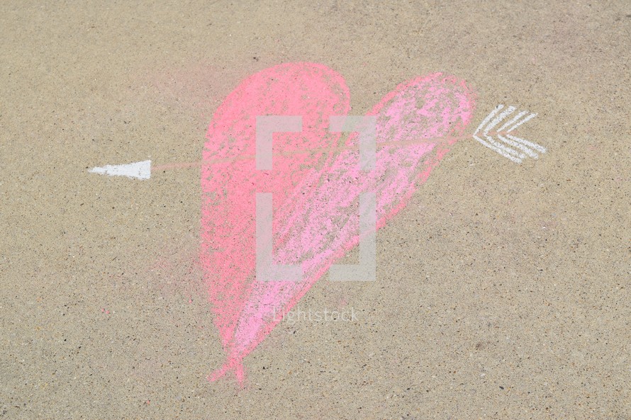 cupid's arrow through a heart in sidewalk chalk 