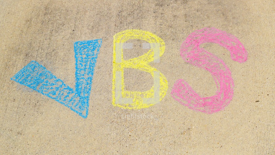 VBS title in sidewalk chalk 