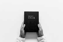 hands holding a Holy Bible 