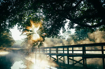 bridge over a steaming pond 