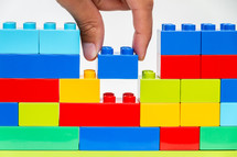 Building a wall with plastic blocks