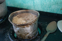 food cooking on a stove in a third world country 