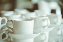 coffee cups and saucers in a diner 