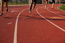 runners racing on a track 