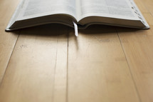open Bible on the floor