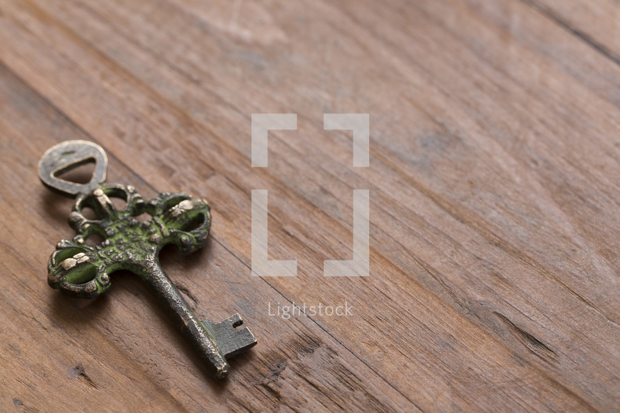 skeleton key on a wood background 
