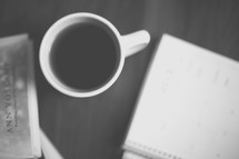 coffe mug, book, and notepad 