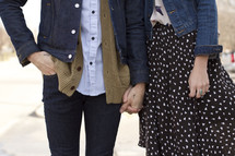 young couple holding hands 