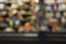 blurry image of a woman shopping in a grocery store