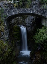 stone bridge over a waterfall 
