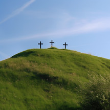 3 crosses on a grass hill