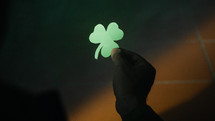 Holding A Green Clover in the night