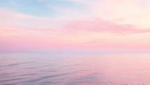 Sunset on ocean in pink color for breast cancer day concept