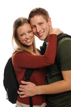 male and female student hugging 