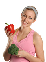 woman holding and looking at vegetables 