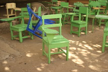 rows of student chairs in a classroom 