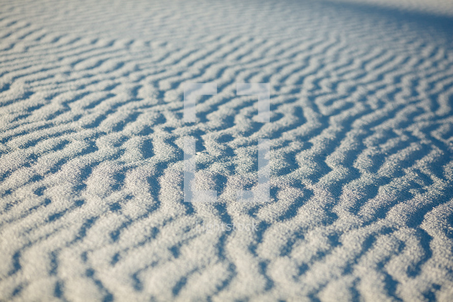 ripples in white sand 