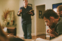 men gathered at a bible study