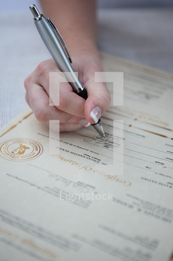 Completing a marriage license.