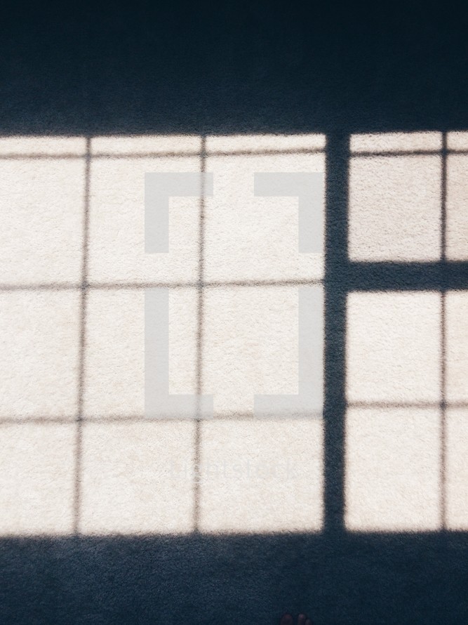 blocked pattern shadows on concrete 