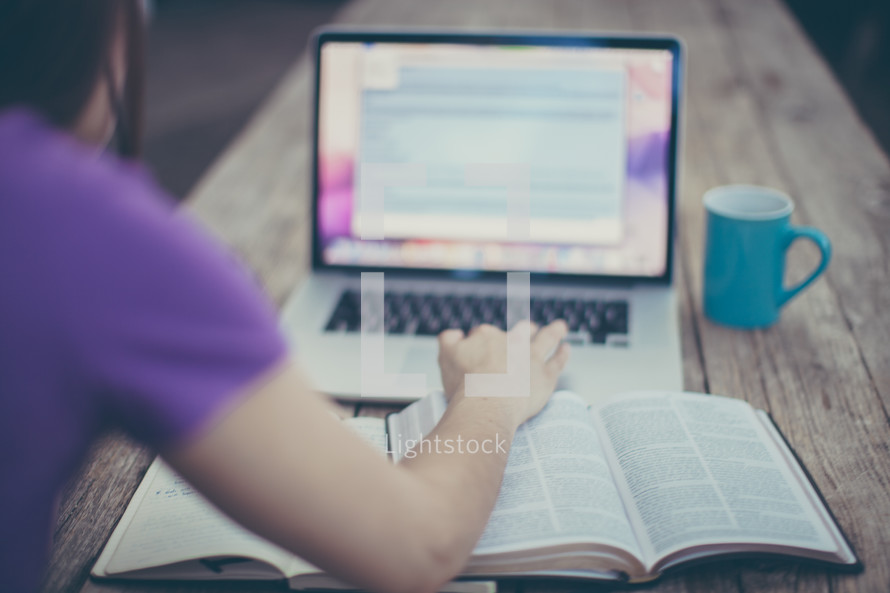 woman, open Bible, journal, computer screen, and coffee mug 